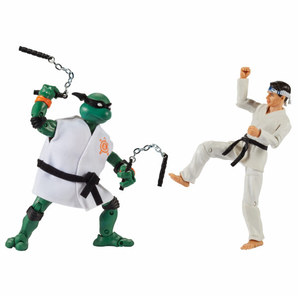 STL214434_1 TMNT X COBRA KAI MICHELANGELO VS DANIEL LARUSSO AF 2PK